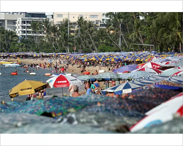 Beach scene with umbrellas and hotels on the seafront of Pattaya, Thailand