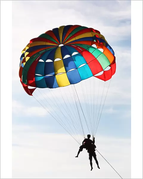 Tourists parascending with a parachute on Patong Beach, Phuket, Thailand