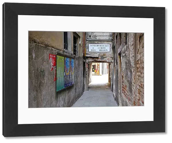 Street scene of a sortoportego tunnel under buildings in Venice, Italy