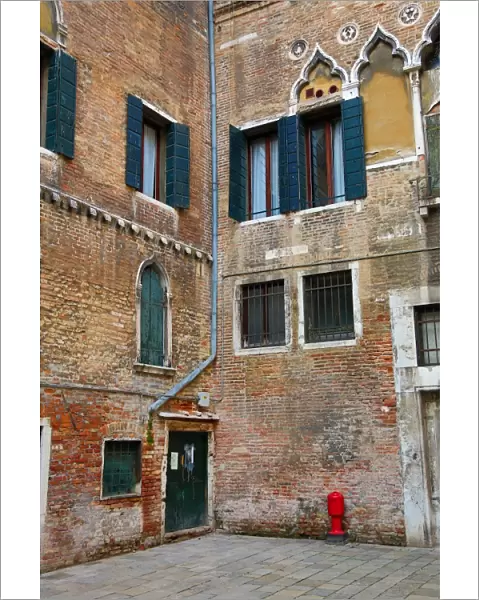 Old Italian architecture of a building in a square in Venice, Italy