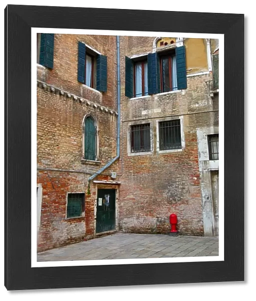Old Italian architecture of a building in a square in Venice, Italy