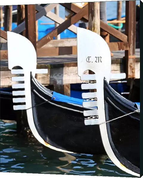 Prows of moored gondolas in Venice, Italy