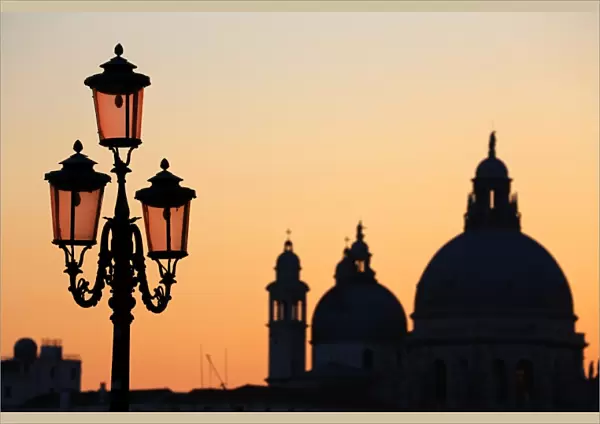 Santa Maria Della Salute and a lamp post at sunset in Venice, Italy