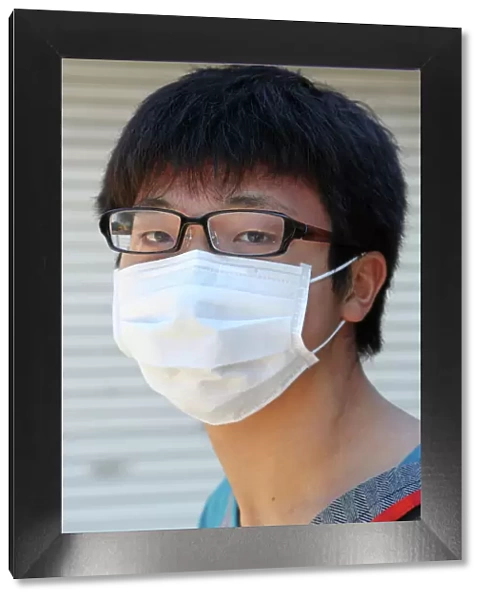 Japanese man wearing a protective face mask, Tokyo, Japan