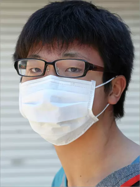 Japanese man wearing a protective face mask, Tokyo, Japan