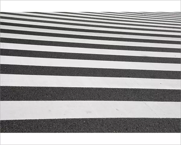 Black and white lines of a Japanese zebra pedestrian crossing in Ginza, Tokyo, Japan