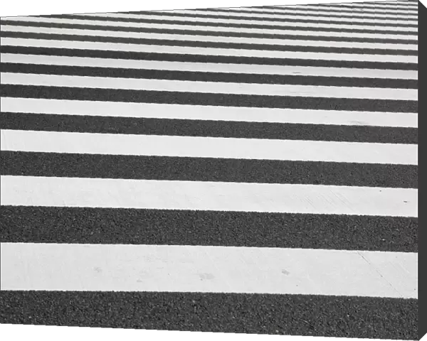 Black and white lines of a Japanese zebra pedestrian crossing in Ginza, Tokyo, Japan