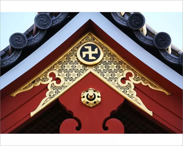 Gold Buddhist cross symbol on a roof at the Sensoji Asakusa Kannon Temple, Tokyo, Japan