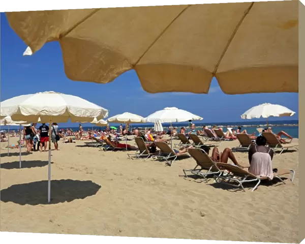 Scene of holiday crowds on the beach, Barcelona, Spain
