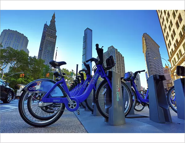 Skyscraper buildings around Madison Square and Citibike bicycle hire bicycles, New York, America