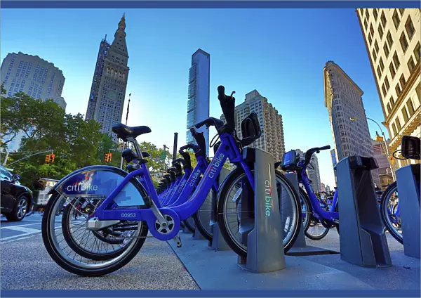 Skyscraper buildings around Madison Square and Citibike bicycle hire bicycles, New York, America