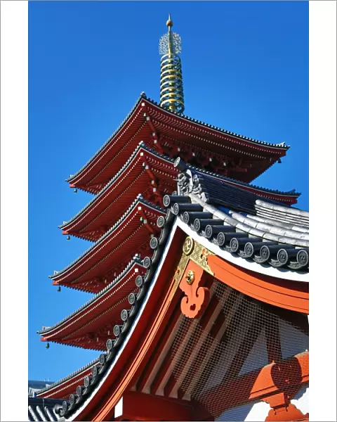 Traditional wooden roof and pagoda at the Shinto Shrine at Senso-Ji Bhuddist Temple in Asakusa in Tokyo, Japan