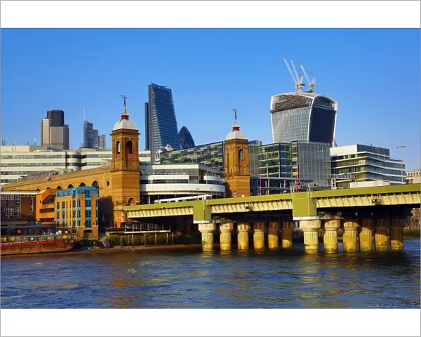 River Thames with Cannon Street railway bridge and the City of London skyline in London, England
