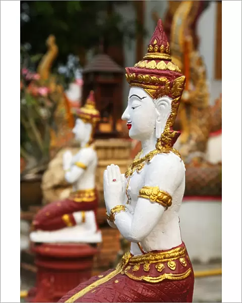 Praying statue at Wat Lam Chang Temple in Chiang Mai, Thailand