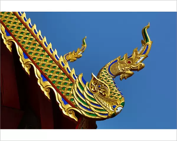 Gold roof decorations at Wat Sum Pow Temple in Chiang Mai, Thailand