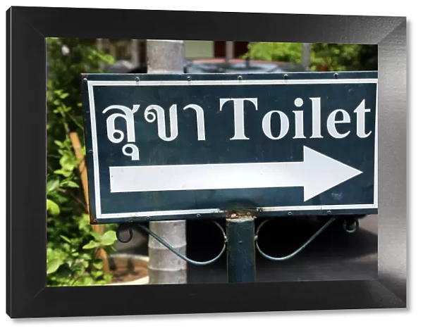 Toilet sign in Thai at Wat Phra Singh Temple in Chiang Mai, Thailand