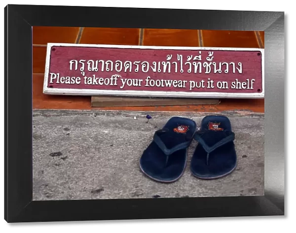 Take of your shoes sign at Wat Chedi Luang temple in Chiang Mai, Thailand