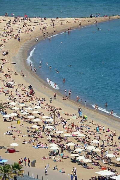 Aerial view of crowds on the crowded beach, Barcelona, Spain