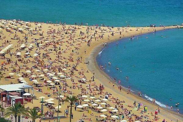 Aerial view of crowds on the crowded beach, Barcelona, Spain
