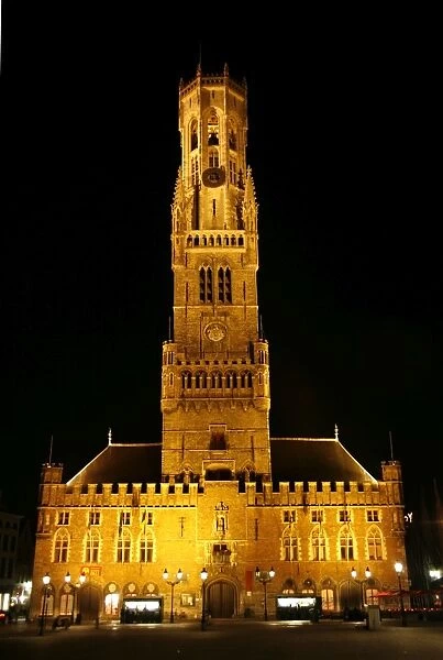Bruges, Belgium. The Belfry Tower and Cloth Hall in the Market Square in Bruges at night