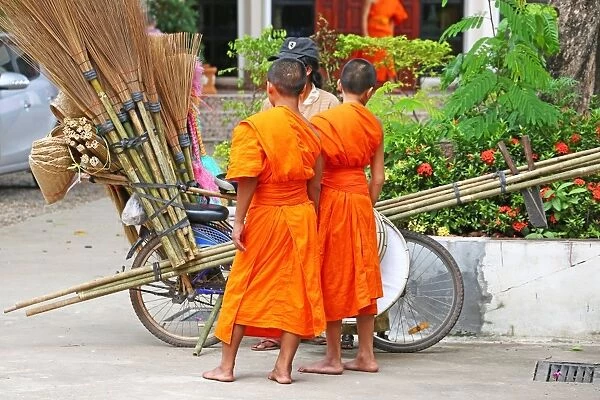 Buddhist Monks buying brushes, Vientiane, Laos