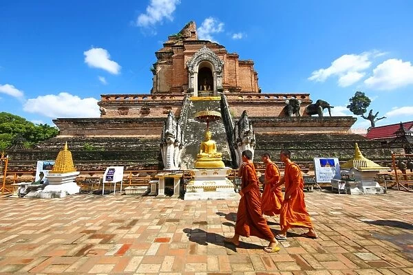 Buddhist Monks at Chedi at Wat Chedi Luang Temple in Chiang Mai, Thailand