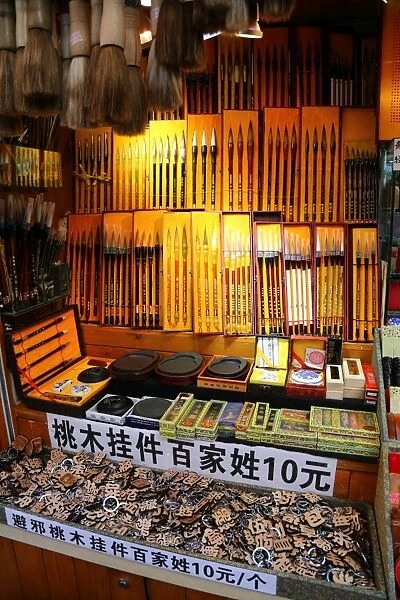 Calligraphy brushes used in writing and drawing on sale on a street stall, Shanghai, China
