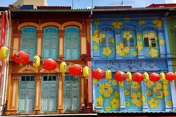 Chinese lanterns hanging in the street between buildings in Chinatown, Singapore