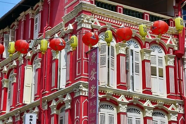 Chinese lanterns hanging in the street between buildings in Chinatown, Singapore