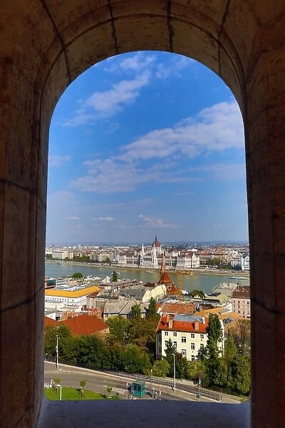 City skyline seen through a window of the Fishermans Bastion in Budapest, Hungary