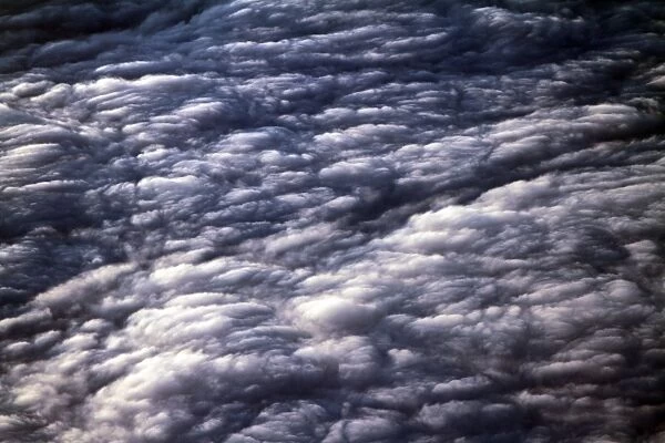 Clouds. Aerial view of the sky from above fluffy clouds at sunset