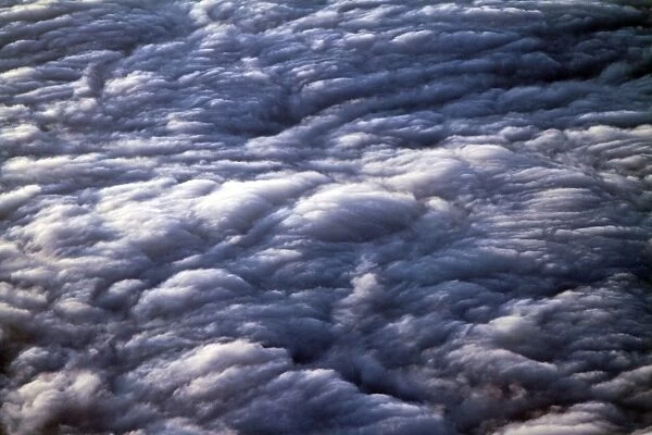 Clouds. Aerial view of the sky from above fluffy clouds at sunset