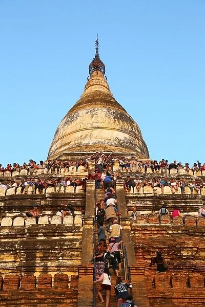 Crowds of tourists on Shwesandaw Pagoda to watch the sunset in Bagan, Myanmar (Burma)