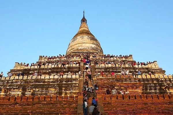 Crowds of tourists on Shwesandaw Pagoda to watch the sunset in Bagan, Myanmar (Burma)