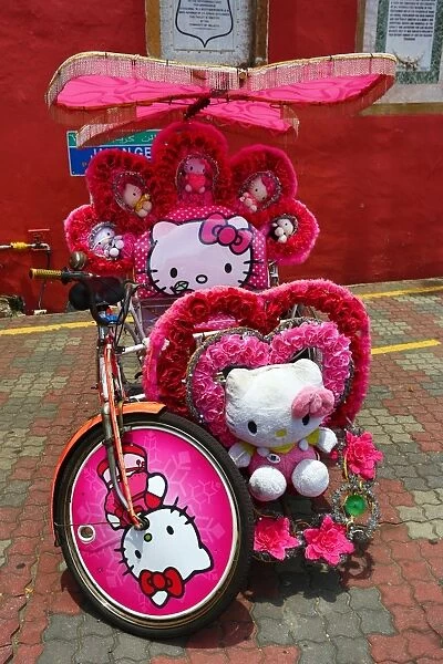 Decorated kitsch cycle trishaw rickshaw with soft toys in Malacca, Malaysia