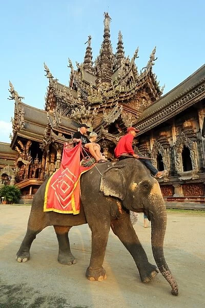 Elephant Tour for tourists at the Sanctuary of Truth Temple, Prasat Sut Ja-Tum, Pattaya, Thailand