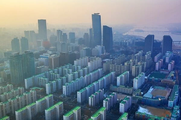 General view of blocks of flats and the Seoul city skyline at dusk in Seoul, Korea