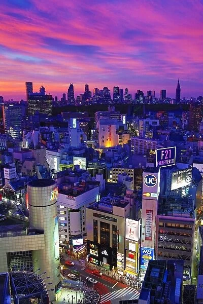 General view of the city skyline of Shinjuku at sunset seen from Shibuya, Tokyo, Japan