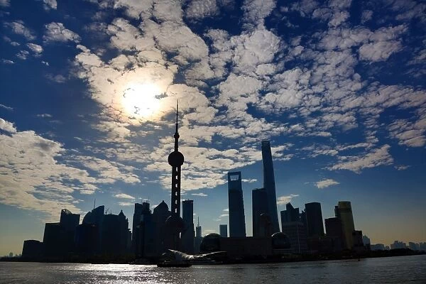 General view of the Pudong city skyline in Shanghai in silhouette with the Oriental Pearl TV Tower, Shanghai, China