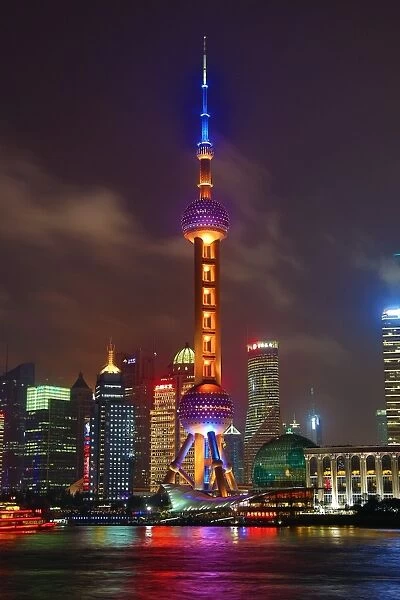 General view of the Pudong city skyline in Shanghai at night with the Oriental Pearl TV Tower, Shanghai, China