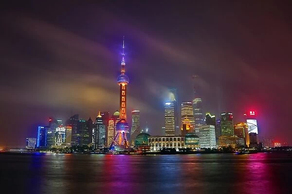 General view of the Pudong city skyline in Shanghai at night with the Oriental Pearl TV Tower, Shanghai, China