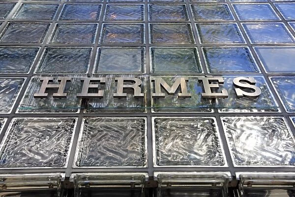 Glass front and logo on the Japanese Hermes shop building in Ginza, Tokyo, Japan
