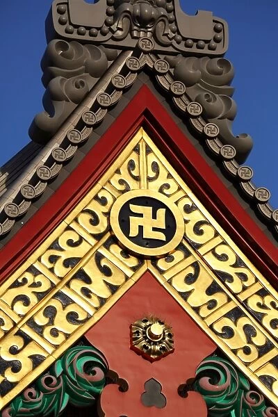 Gold Buddhist cross symbol on a giant vase at the Sensoji Asakusa Kannon Temple, Tokyo, Japan