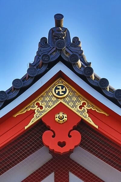 Gold Buddhist cross symbol on a roof at the Sensoji Asakusa Kannon Temple, Tokyo, Japan