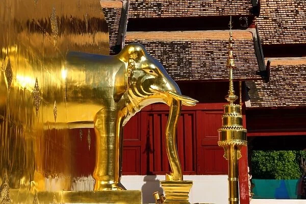 Gold elephant statue on the chedi at Wat Phra Singh Temple in Chiang Mai, Thailand