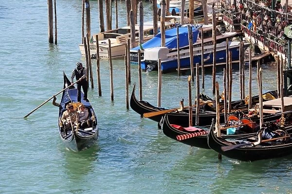 Gondolas sailing on the Grand Canal in Venice, Italy
