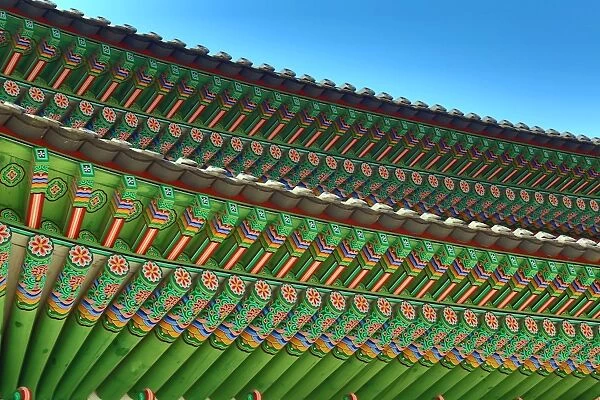 Green wooden roof beams of the Gwanghwamun Gate at Gyeongbokgung Palace in Seoul, Korea