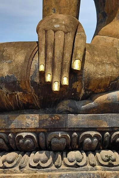 Hand on a Buddha statue, Wat Mahathat temple, Sukhotai, Thailand