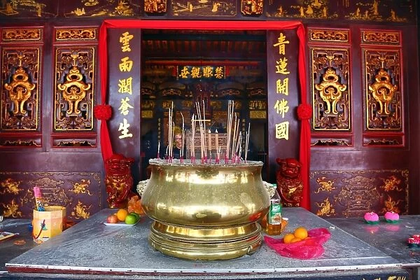 Incense burning on the altar at the Cheng Hoon Teng Chinese Temple in Malacca, Malaysia