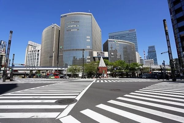 Japanese street scene of modern buildings and a pedestrian crossing in Ginza, Tokyo, Japan